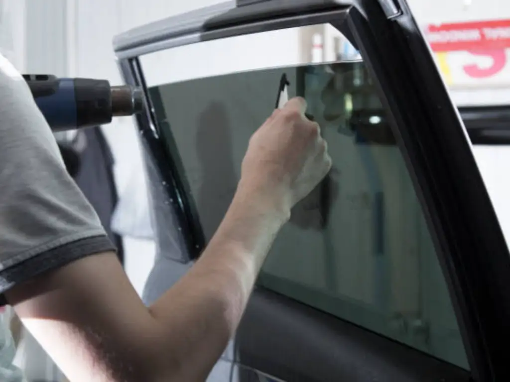 can you tint over factory tint